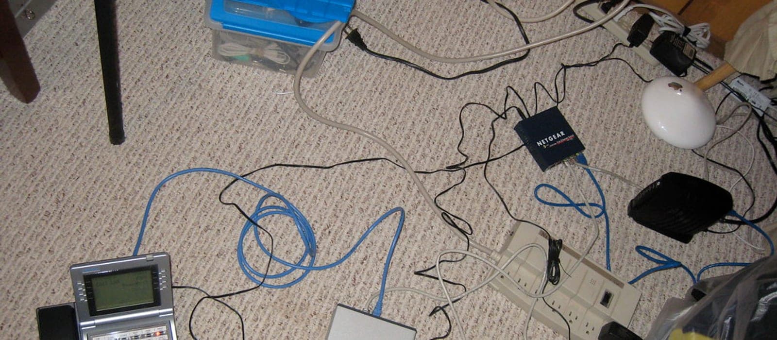 A tidy desk with a monitor arm and routed cables